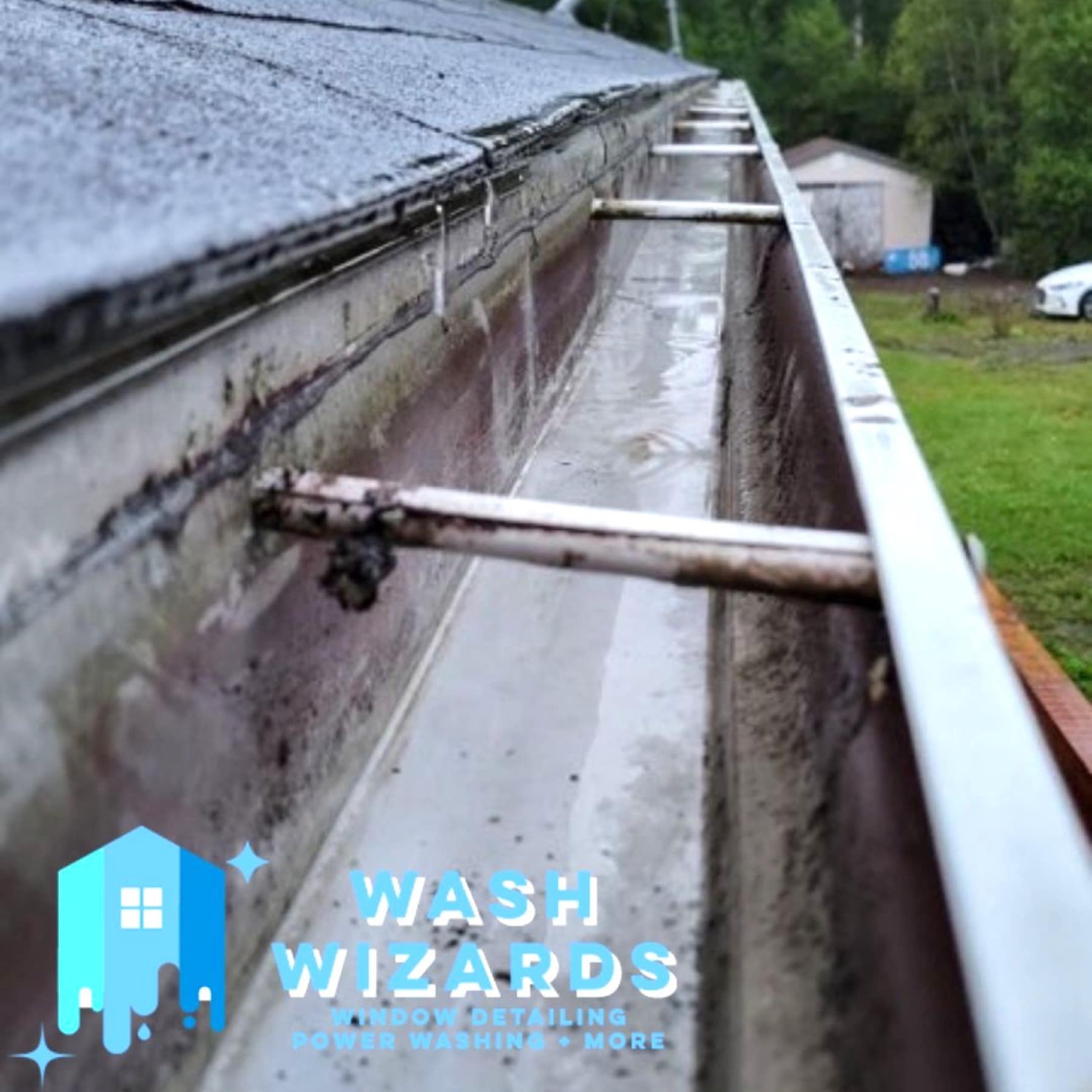 The same gutter run after cleaning, clear down to the bottom