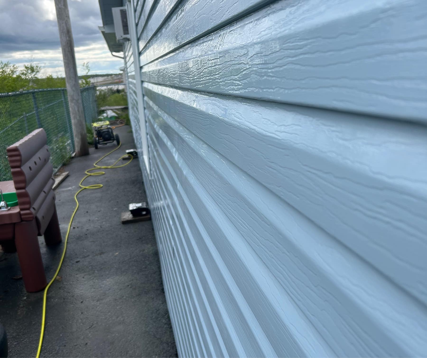 A run of white siding after power washing
